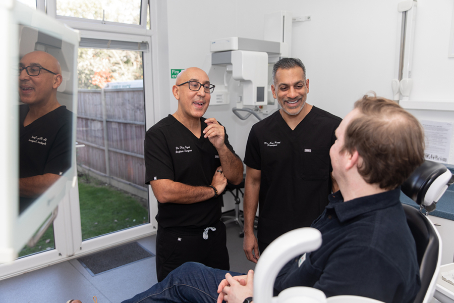 Dr Riz and Dr Sej with a patient image