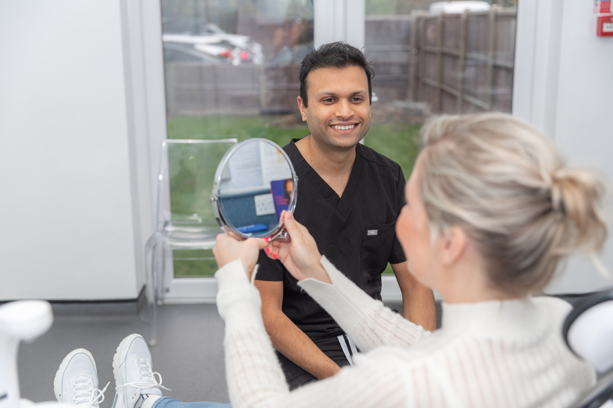 Dr Dipen with a patient. image