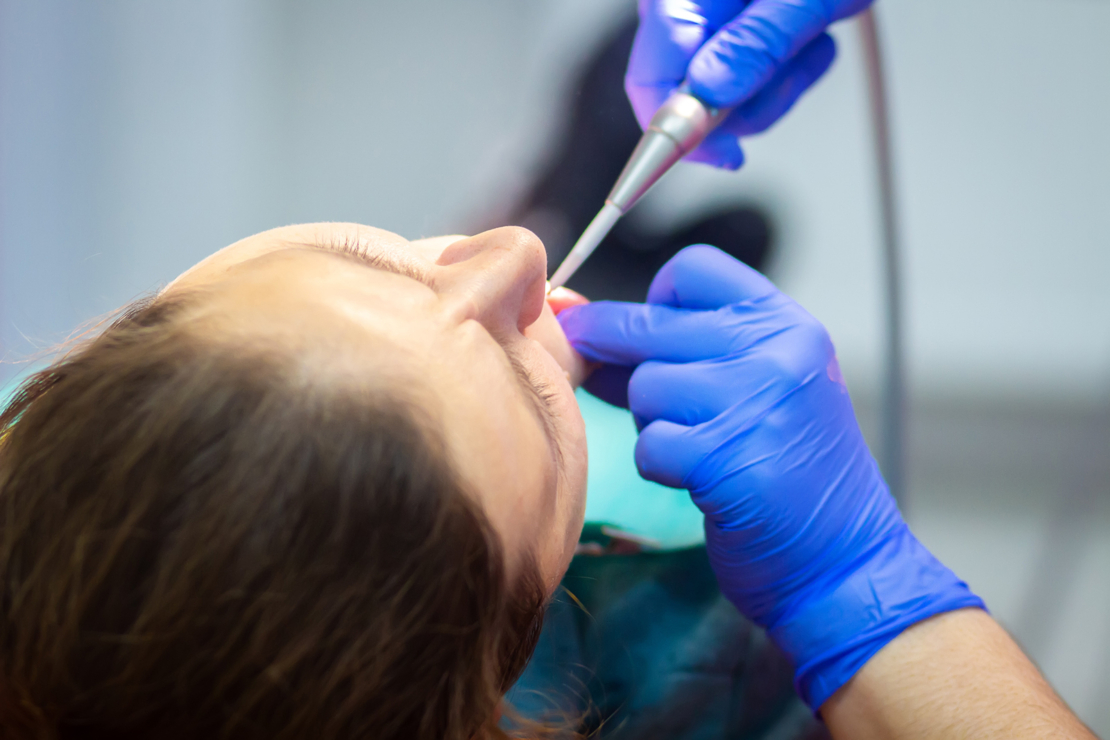 Sedated patient receiving treatment image