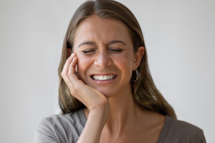Woman with sore tooth image