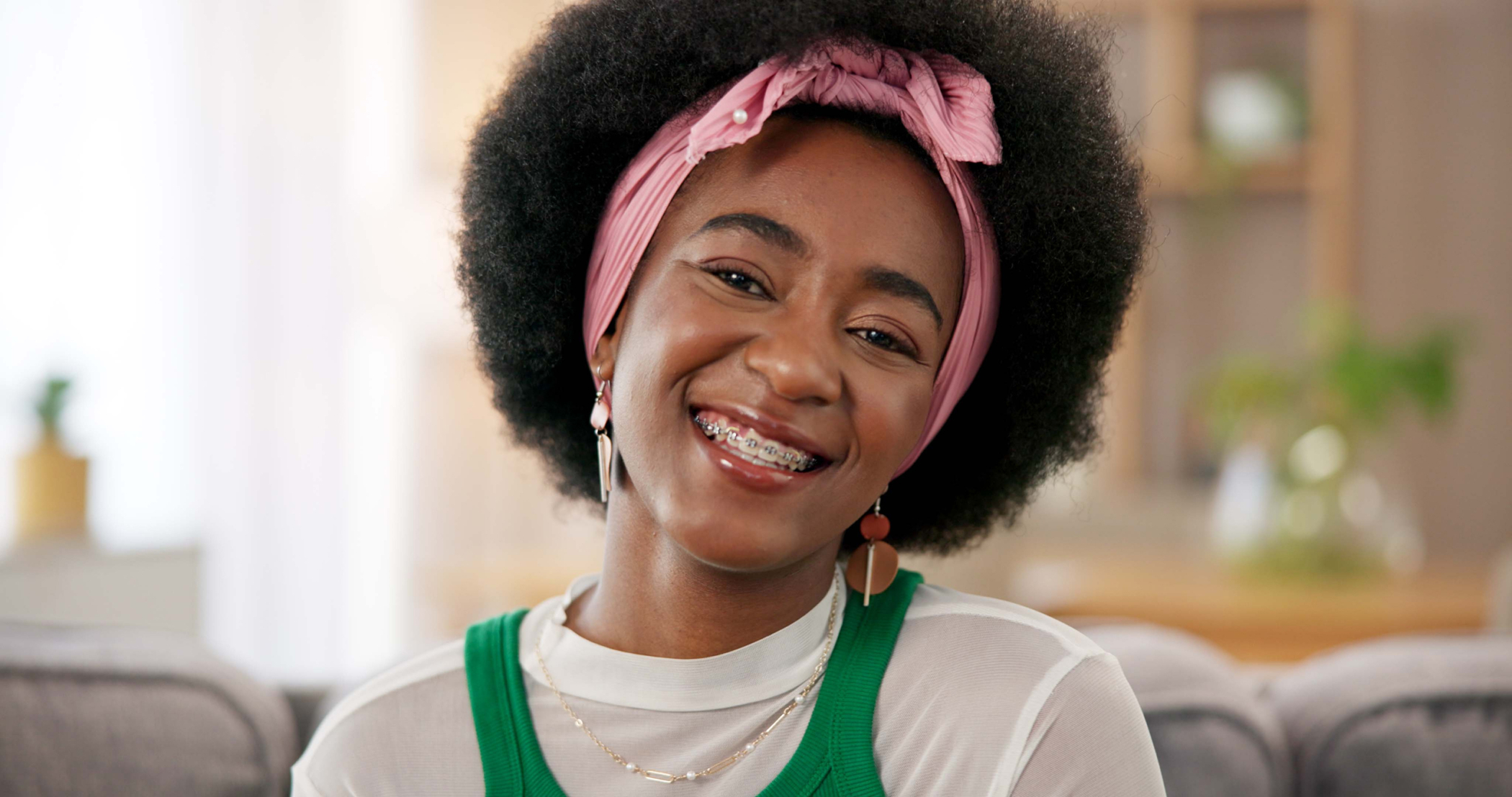 woman on sofa with braces